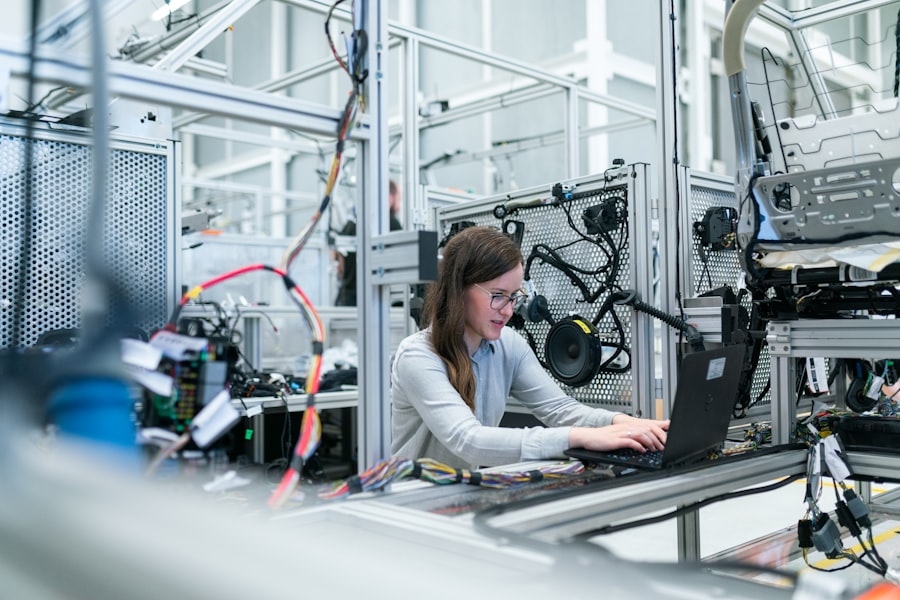 Engineer at laptop in facility